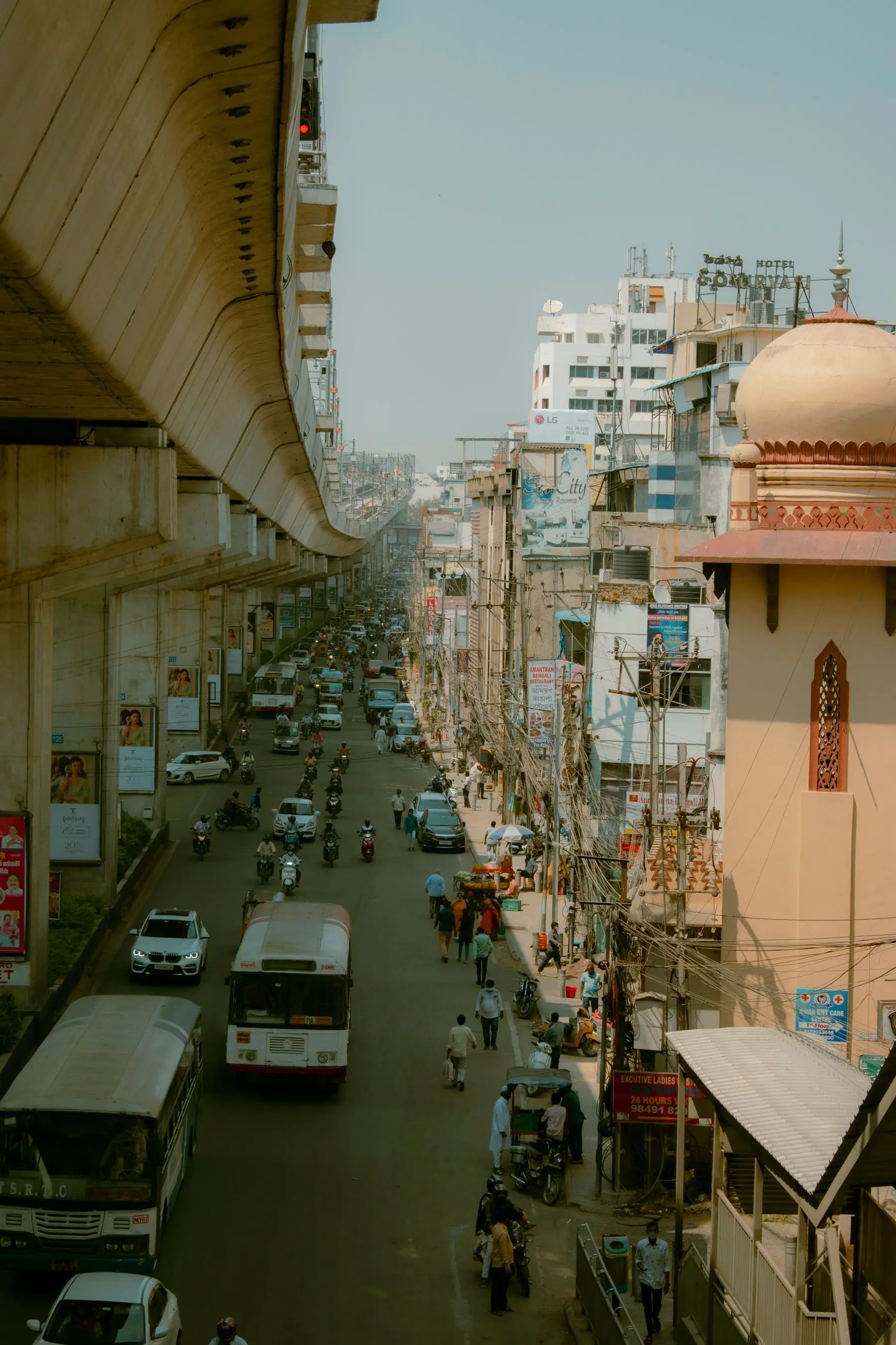 A busy Indian city street with mixed traffic, the everyday environment HeyGo is built for